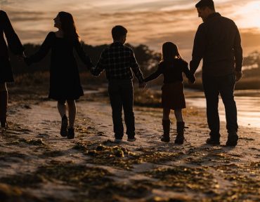 Family walk at sunset